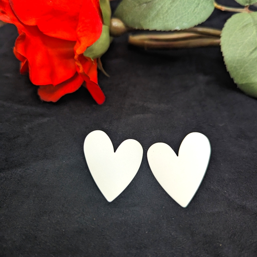 White 🤍 heart shaped stud earrings